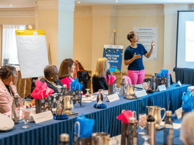 NBCRT Executive Director Ashley Dedmon speaks to the NBCRT Steering Committee after the White House launch.